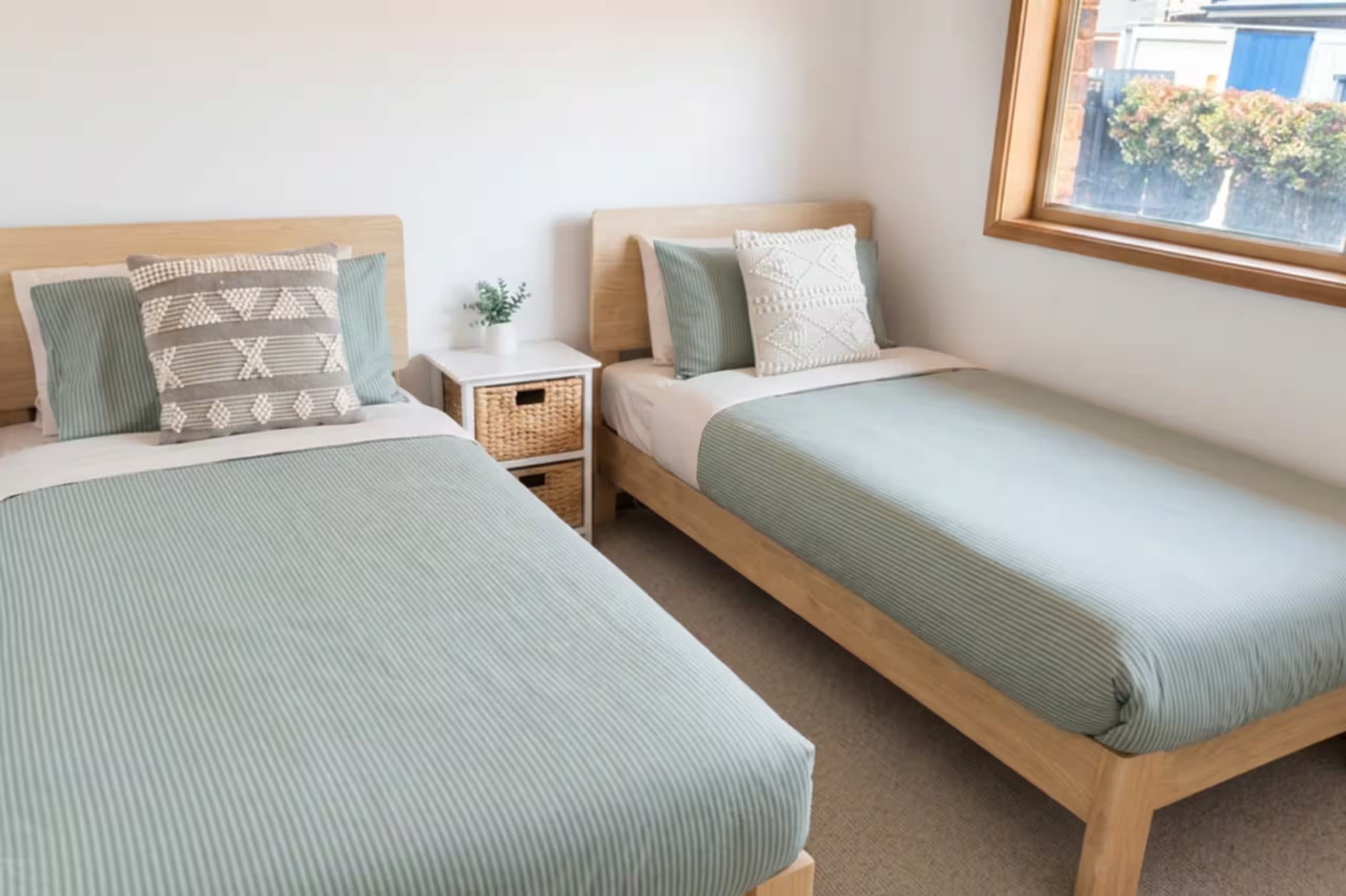Bedroom 3, set up with two single beds — ideal for kids or friends travelling together