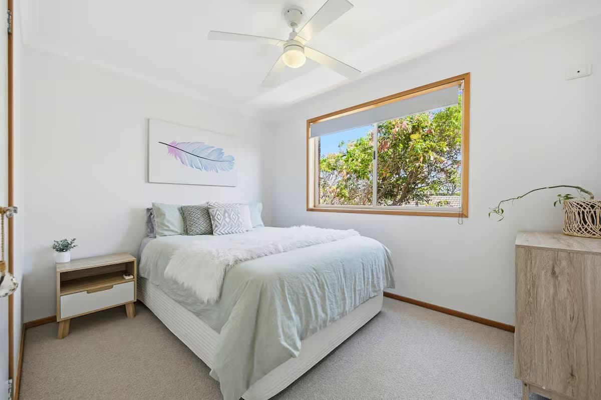 Bedroom 4 with a queen bed, bright and comfortable for a restful night's sleep