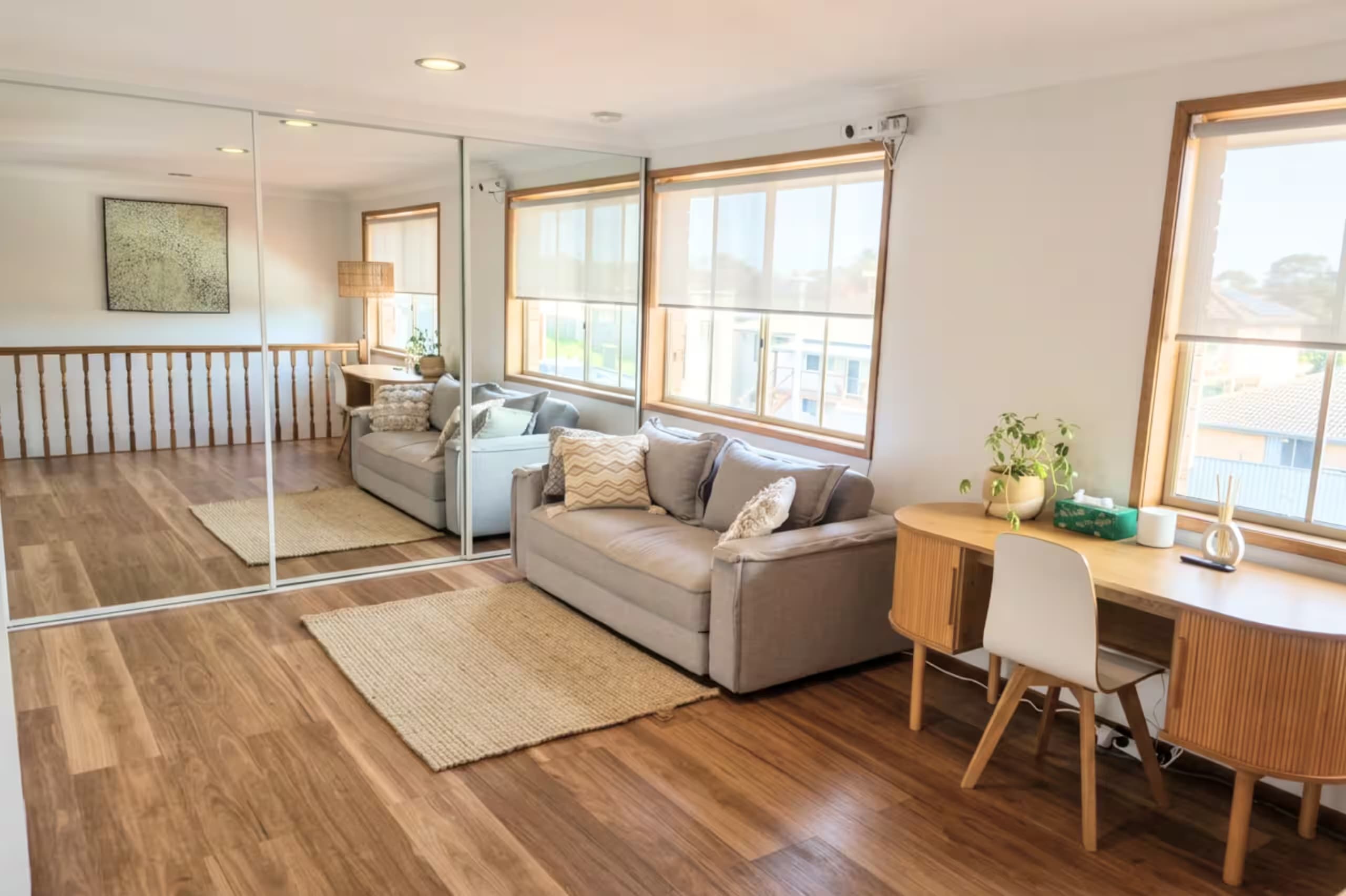 Upstairs living retreat with a comfortable double sofa bed — extra sleeping space for bigger groups