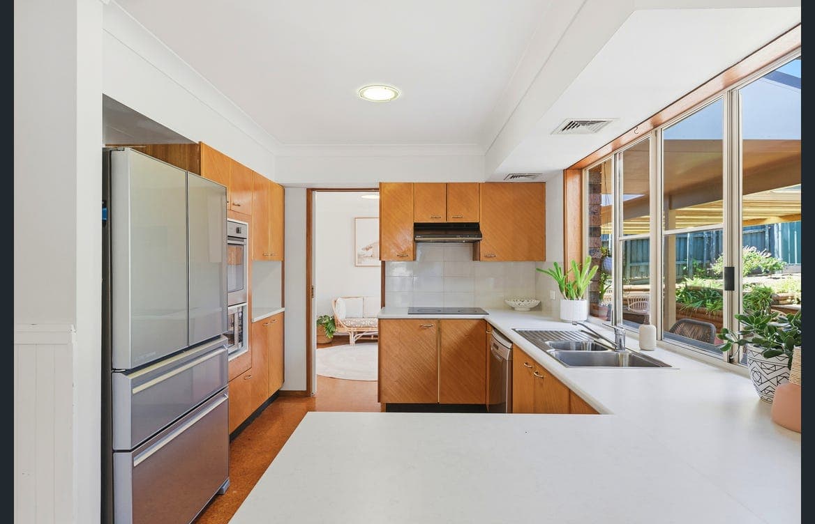 Kitchen and meals area flowing toward outdoor living